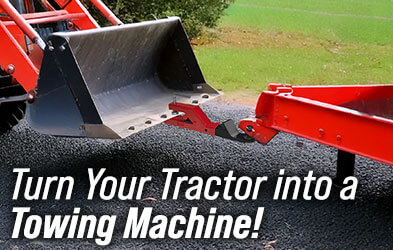Tractor towing trailer with 2-inch Clamp-On Bucket Hitch — towing made easy!